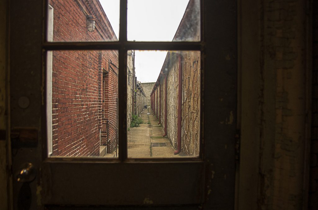 Downspouts viewed through a window